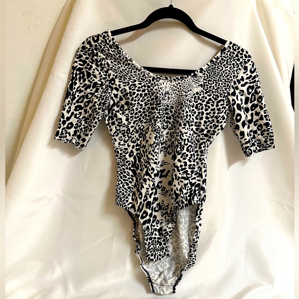 Animal print black and white medium size body suit.